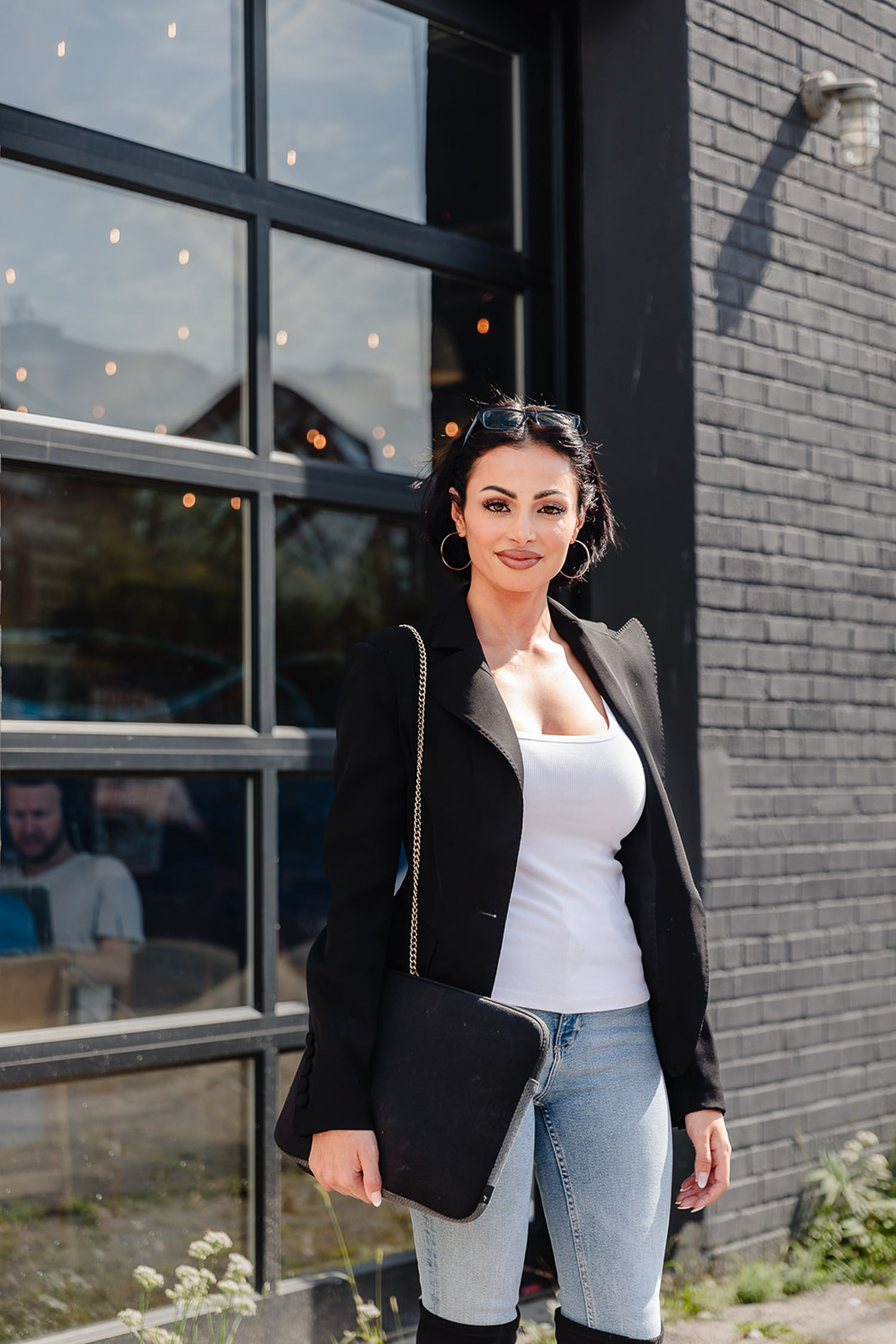 branding session for a matchmaker standing in front of a building